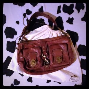 Brown leather coach shoulder bag.